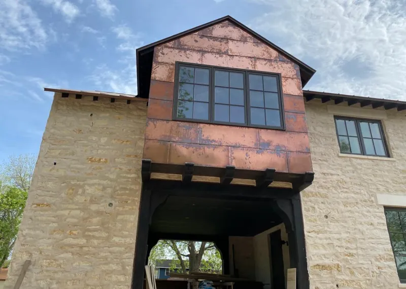 Copper metal panel facade on a stone building for Roof Repair in Avra Valley