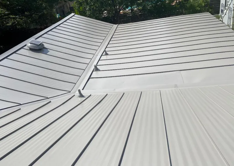 Solar attic fan installed on a metal roof for Roof Ventilation in Avra Valley